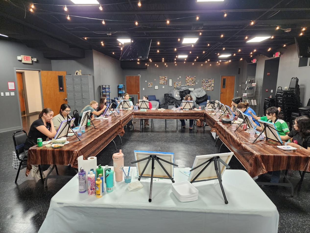 Full group painting at a party